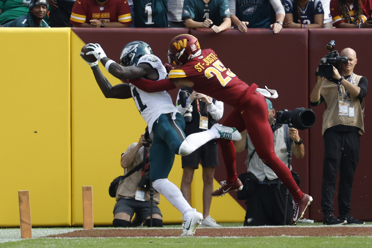 Philadelphia Eagles receiver A.J. Brown catches a touchdown against Washington Commanders cornerback Benjamin St-Juste.